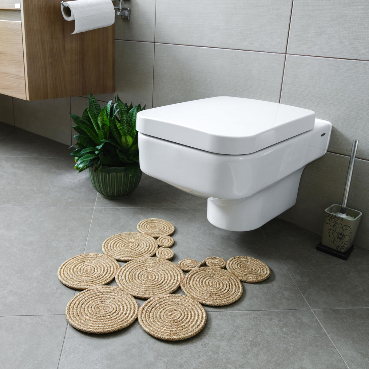 Home Turko Boho Jute Bath Mat in a bright bathroom; demonstrates modern design and moisture absorption