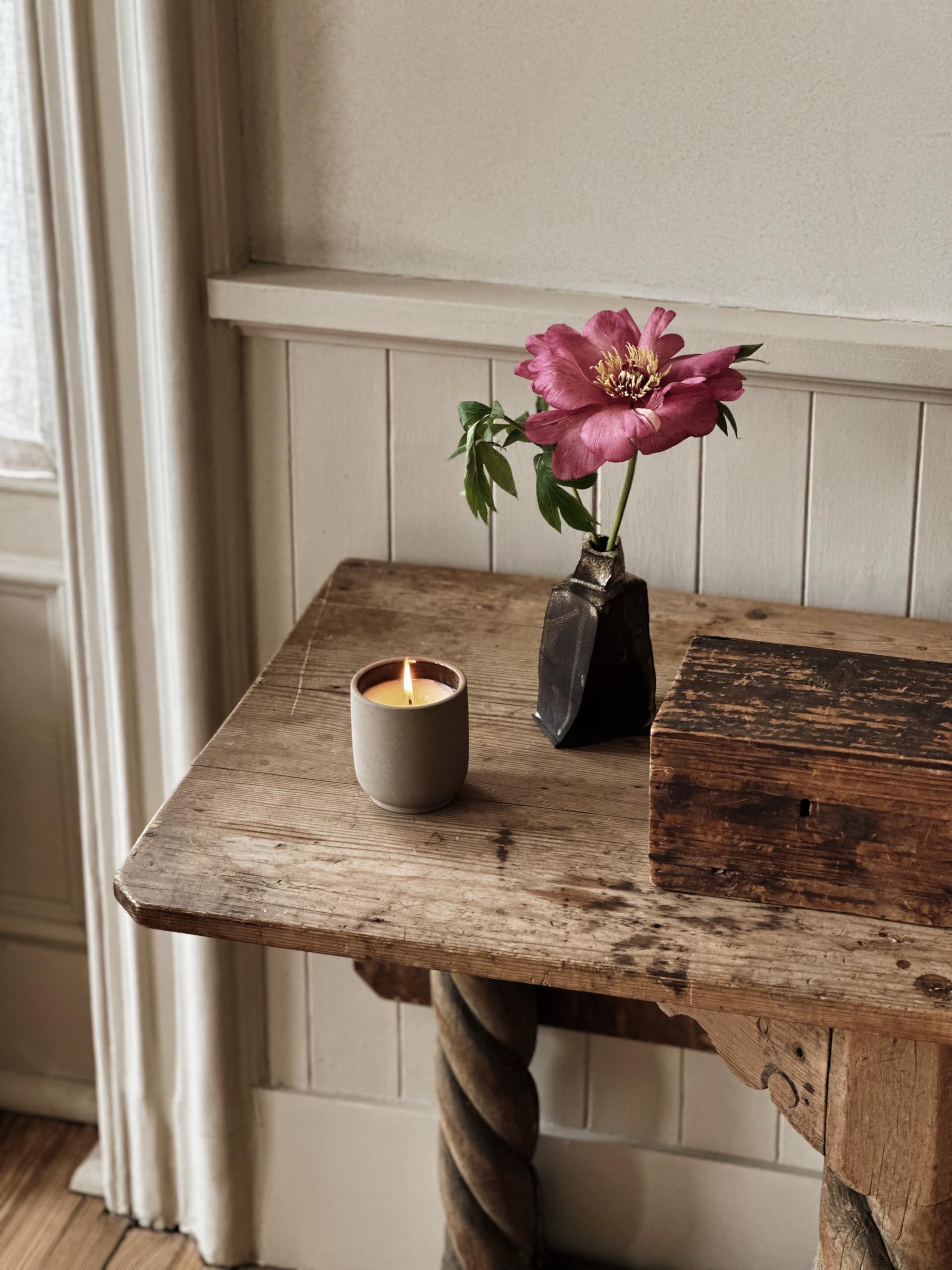 Homecourt Cece candle in a kiln-fired vessel supporting reuse.