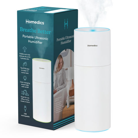 Homedics portable humidifier emitting mist for a fresh bedroom atmosphere