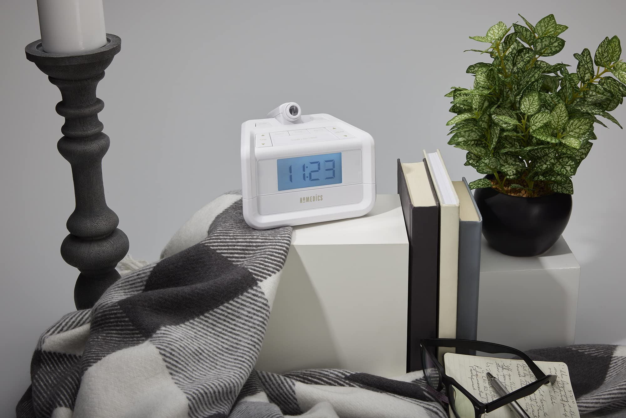 HoMedics SoundSpa ceiling projection casts a blue clock glow