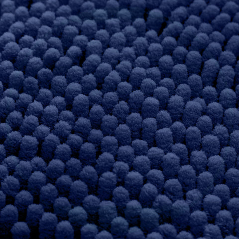HOMEIDEAS Navy rug in a bathroom setting adds comfort