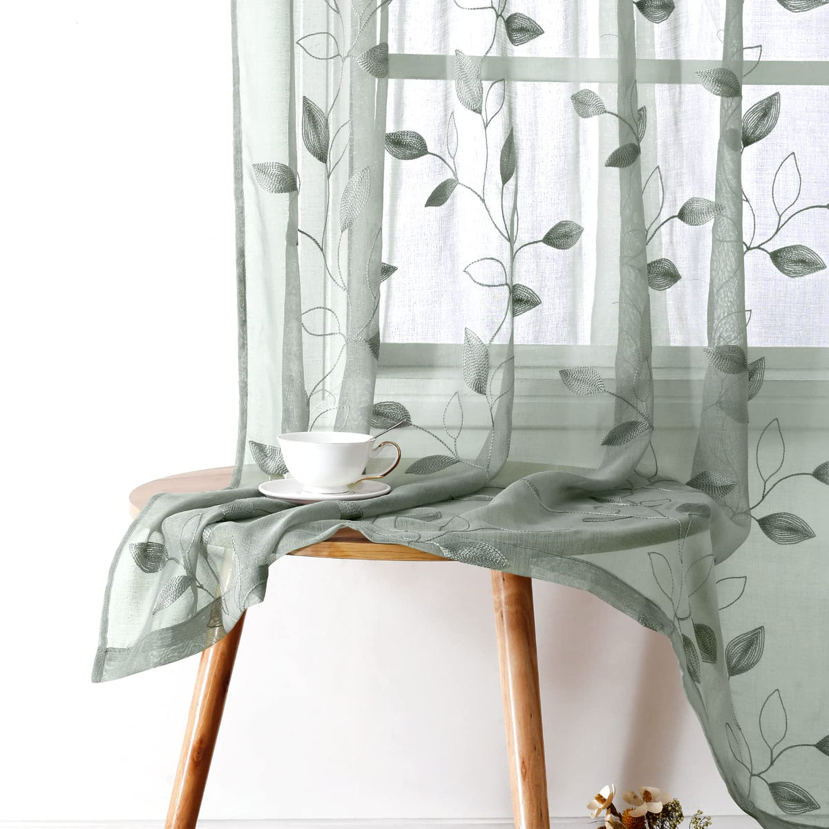 HOMEIDEAS sage green sheer curtains with embroidered leaves filter light while maintaining privacy.