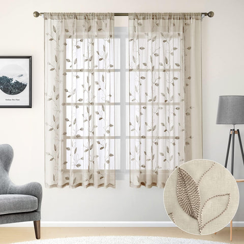 HOMEIDEAS taupe sheer curtains draped on a window provide a bright, airy atmosphere.