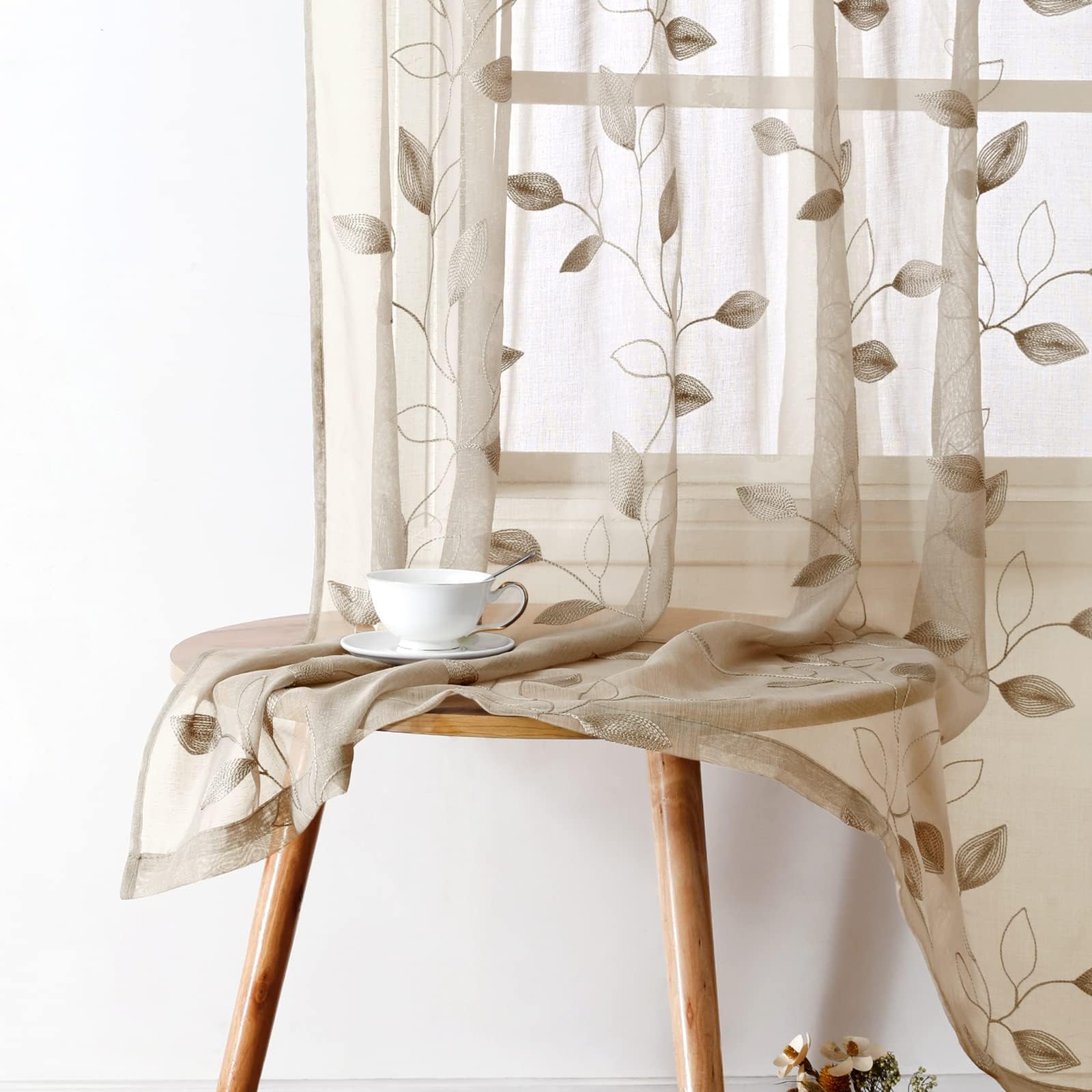 HOMEIDEAS taupe sheer curtains with embroidered leaves create natural elegance and soft lighting.