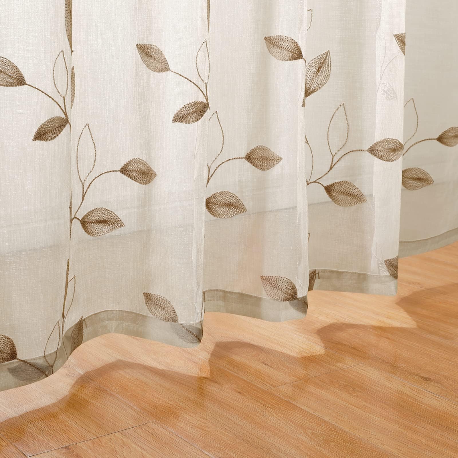 HOMEIDEAS taupe sheer curtains with 3-inch rod pocket hang neatly.