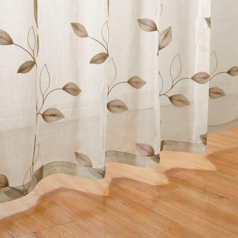 HOMEIDEAS taupe sheer curtains with 3-inch rod pocket hang neatly.