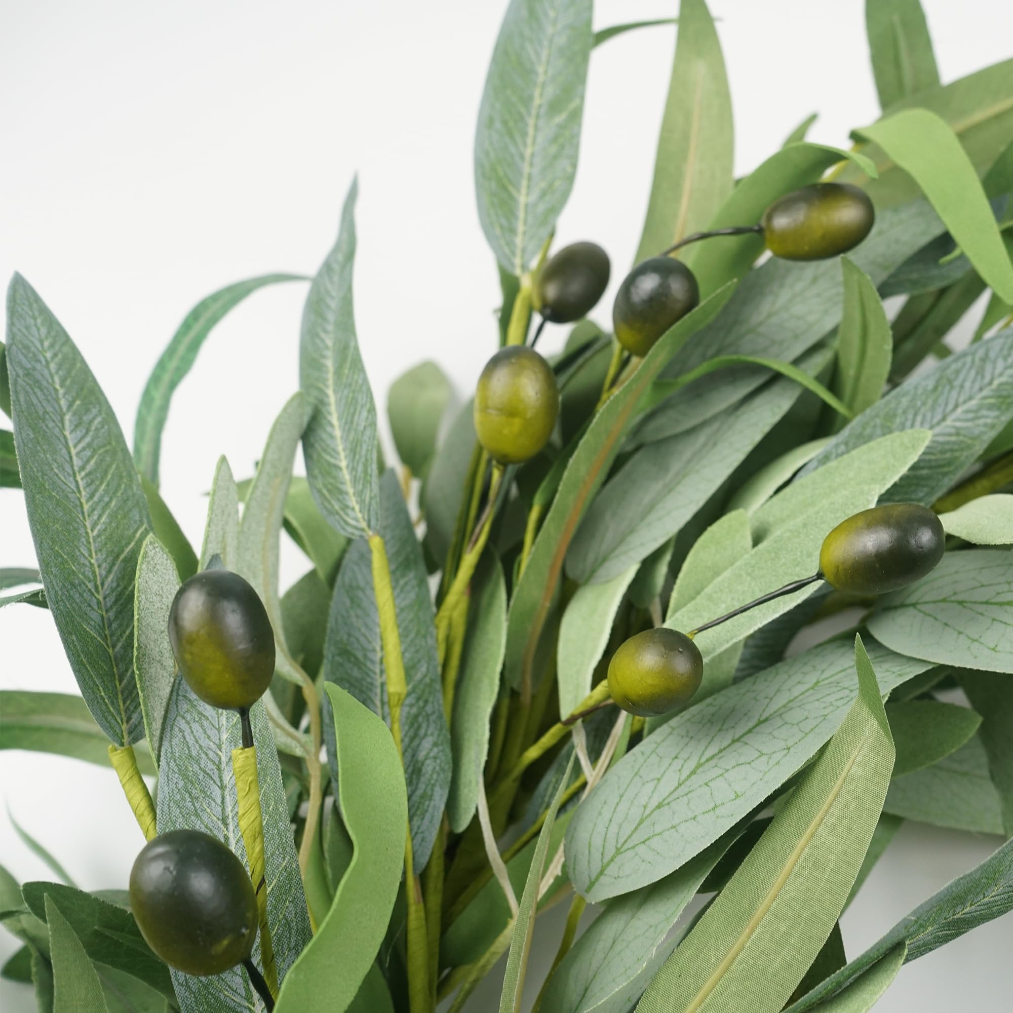 Front door styling for spring and summer with olive wreath.