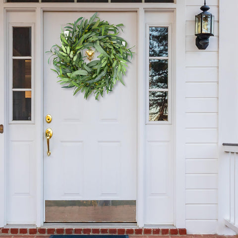 Indoor wall display with olive wreath adding seasonal charm.