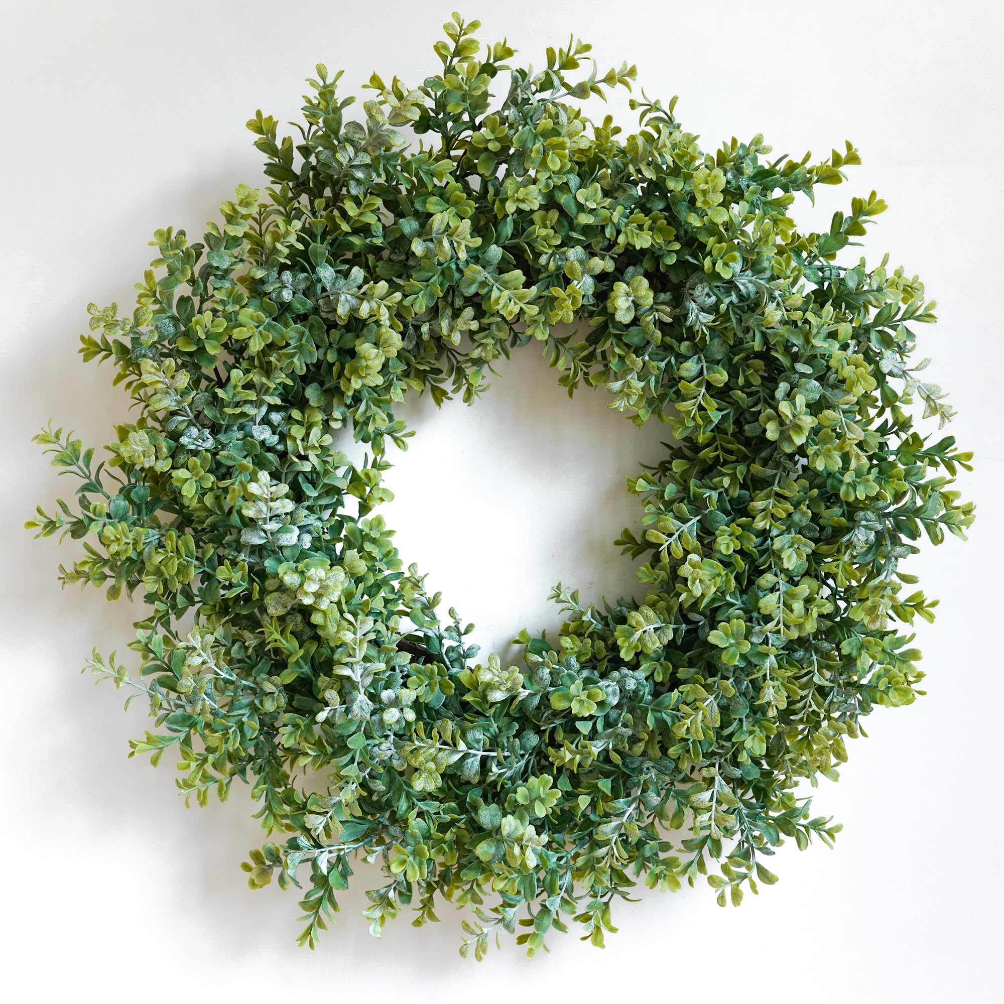 HomeKaren 24-inch front door wreath with eucalyptus and camellia adds year-round charm.