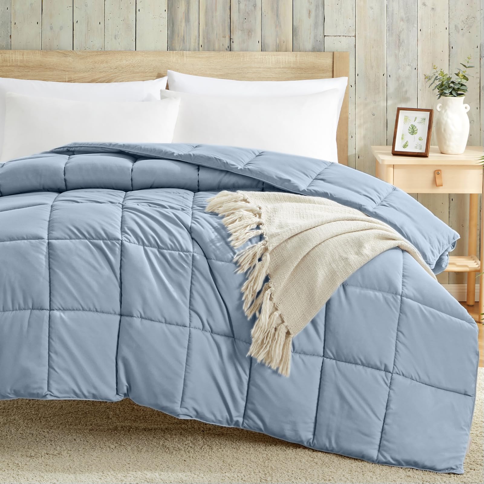 Homelike Moment all-season blue comforter offers adaptable warmth for year-round use.