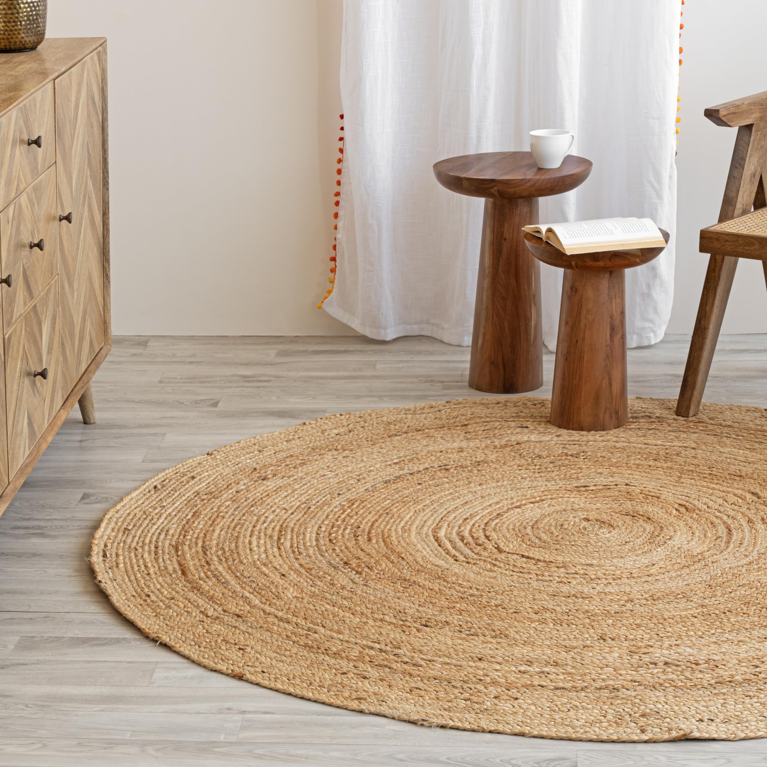 HOMEMONDE round jute rug living room layout blends rustic and bohemian charm