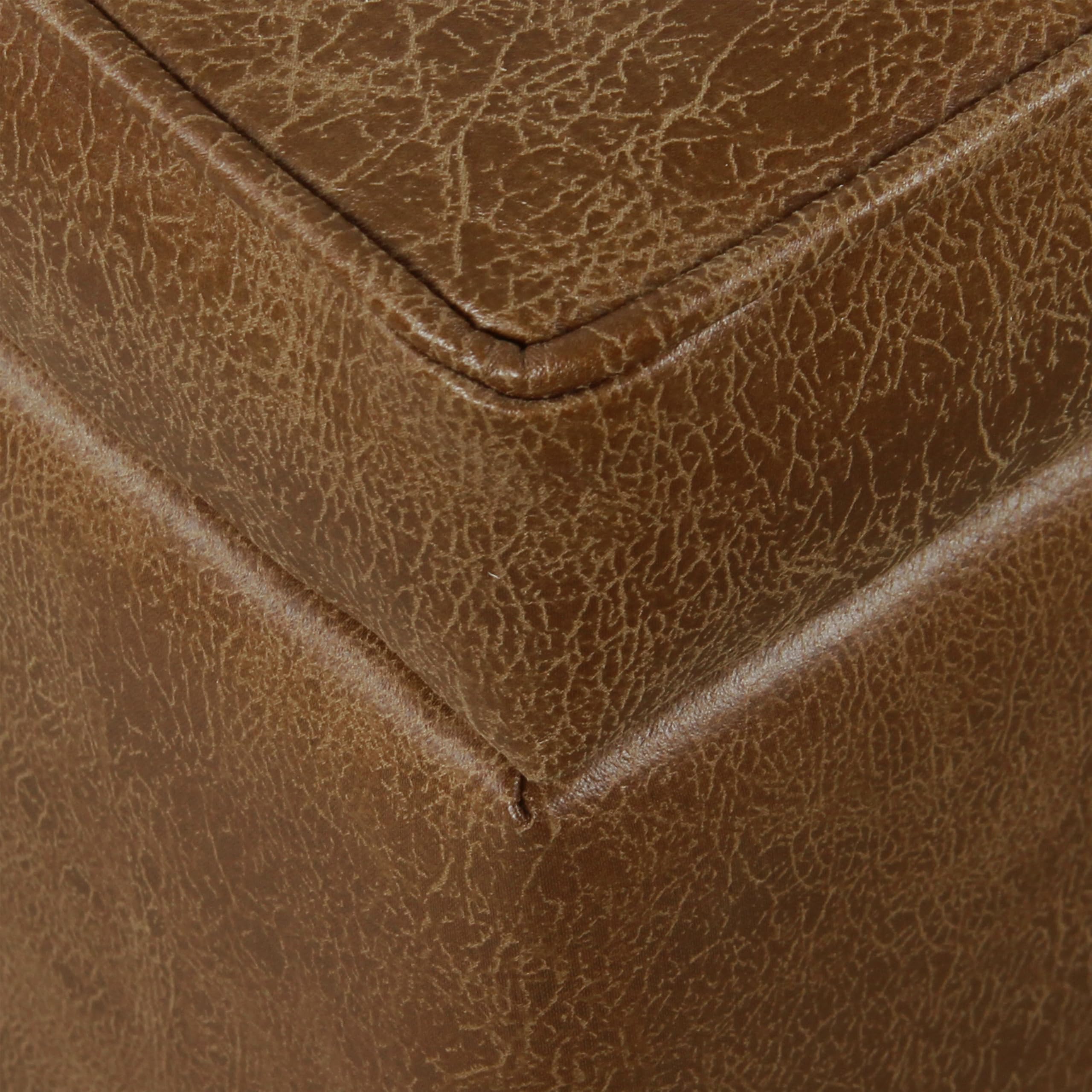 HomePop square tufted storage ottoman side view showing durable faux leather.