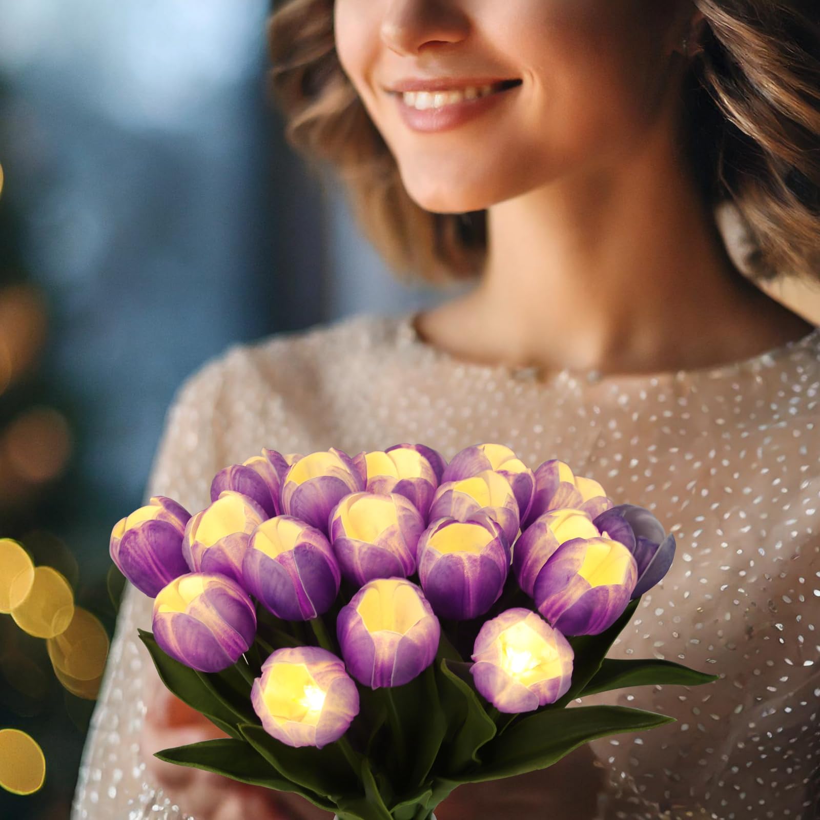 HOMESEASONS tulips in vase display with warm glow suitable for evenings.