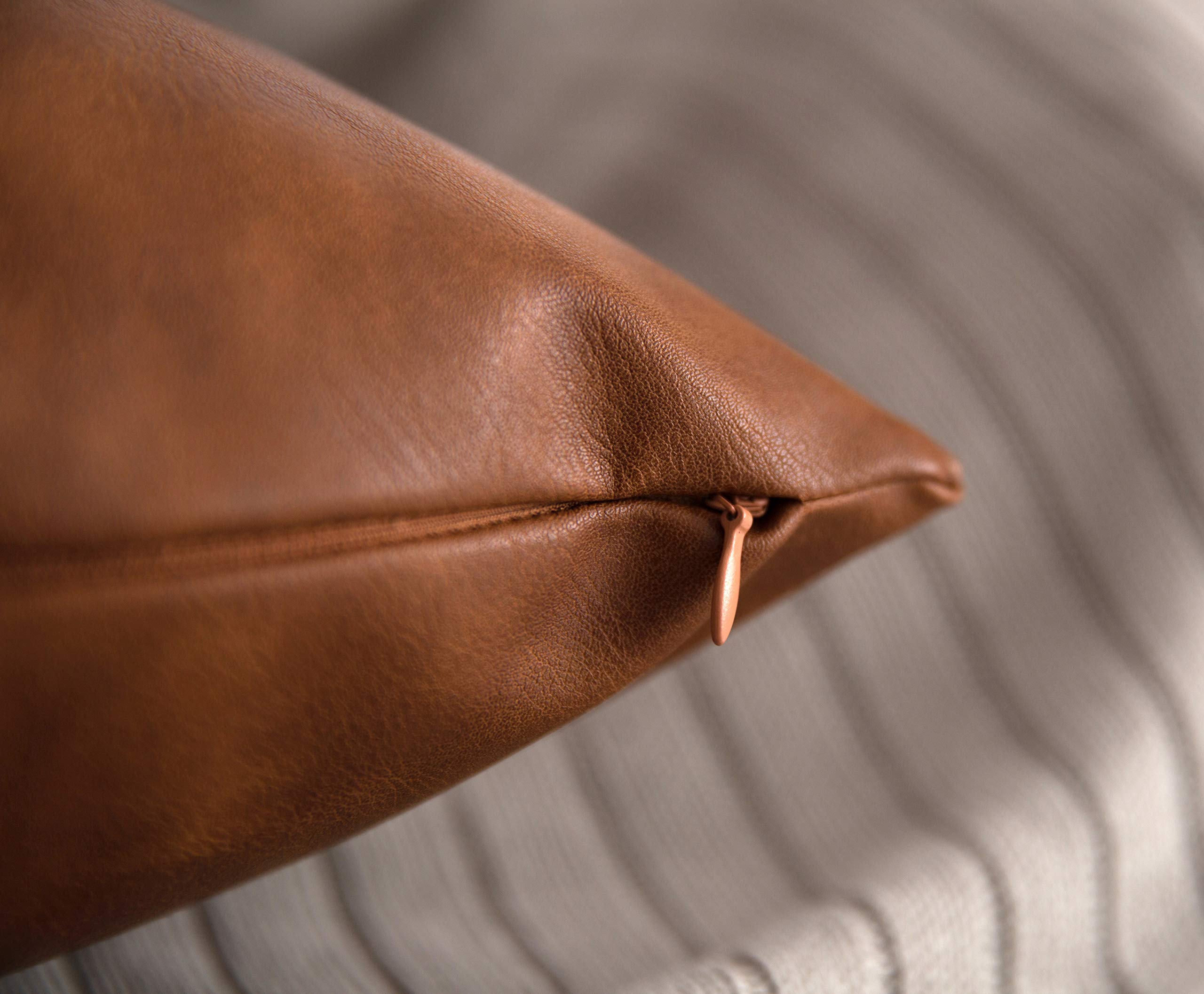 HOMFINER double-stitched faux leather pillow cover promises durability.