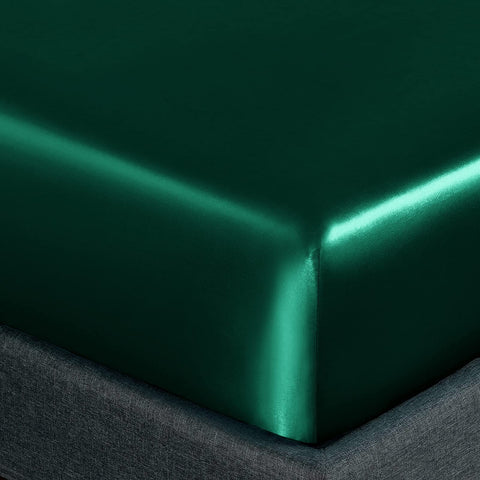 Homiest satin sheets in blackish green add rich color to bedding