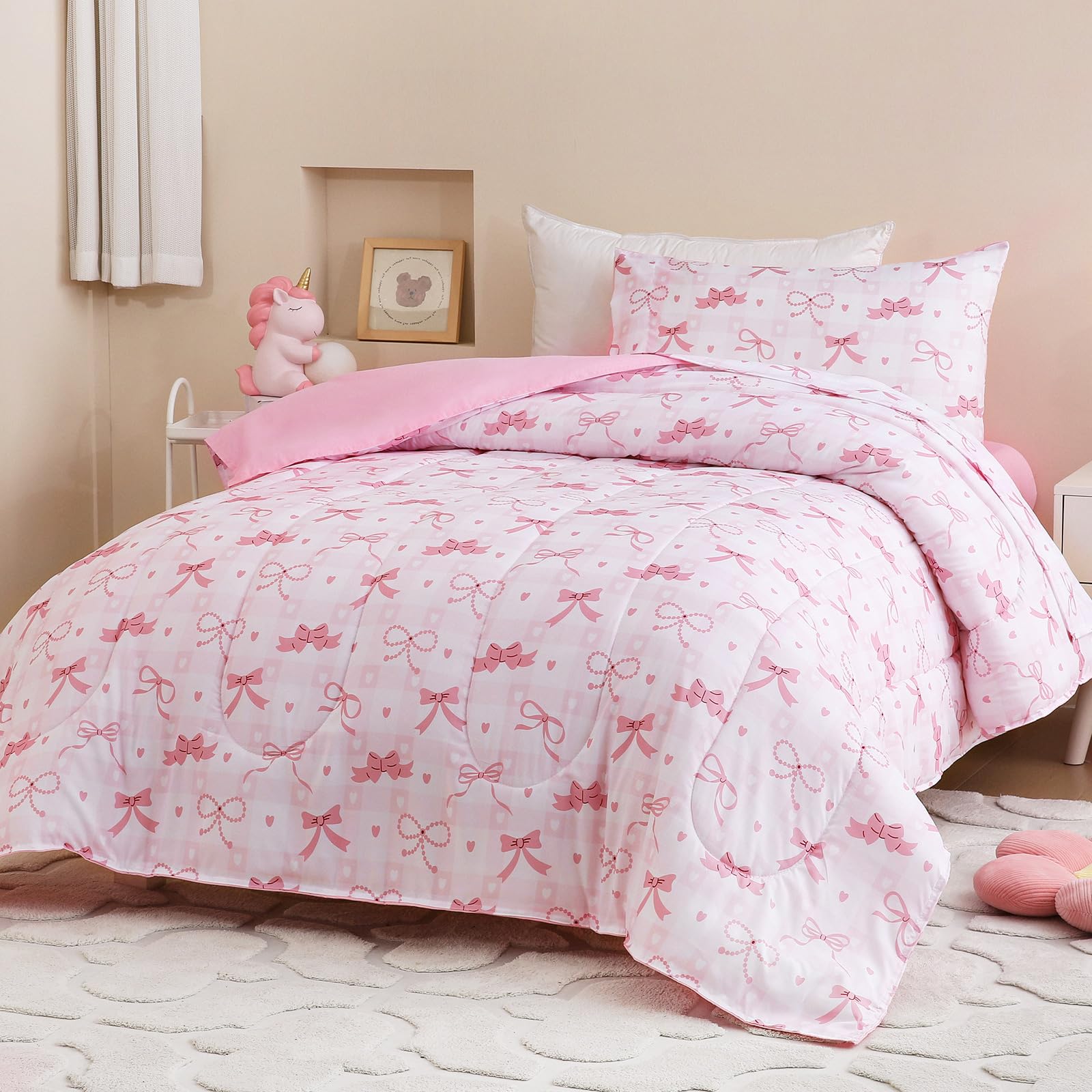 Homilay twin-size pink check comforter set on a kid's bed with all-season softness.