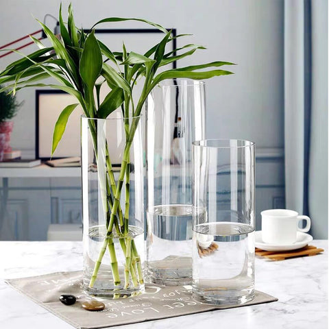 Homjoy glass vases creating a dining table centerpiece idea.