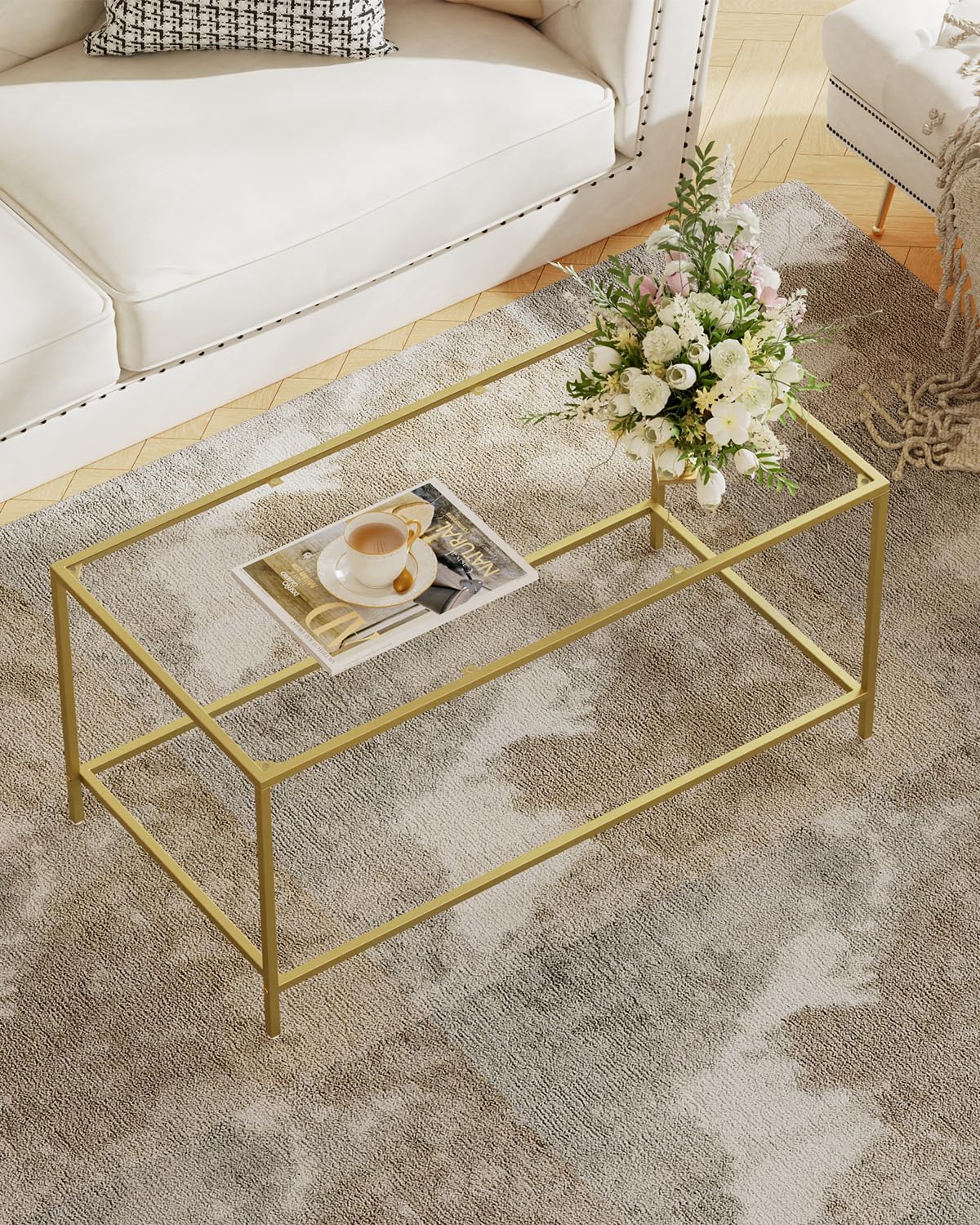 Homleke glass coffee table with gold frame top in living rooms.