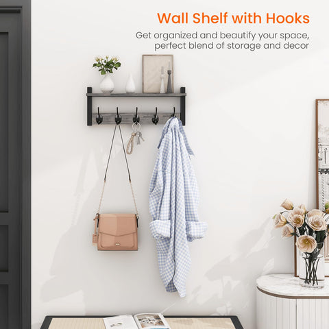 Homode entryway shelf with hooks for decor and essentials.