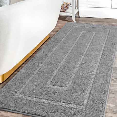 HOMORE Grey bathroom rug 24x60 quick-drying finish keeps floors dry after showers.