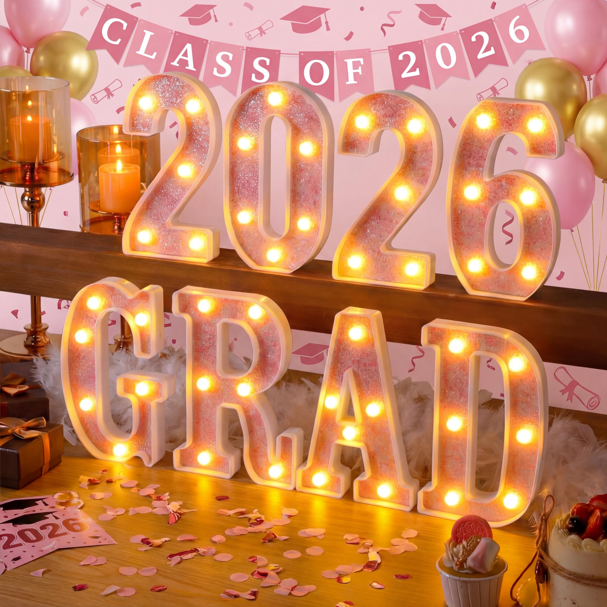 Honoson Grad 2026 pink LED sign lighting up graduation tables