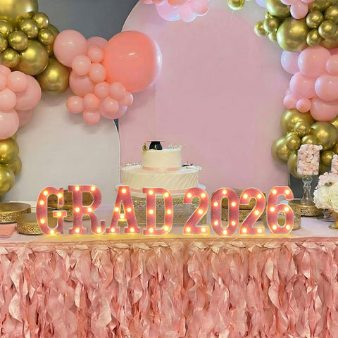 Honoson Grad 2026 table centerpiece with pink LED light