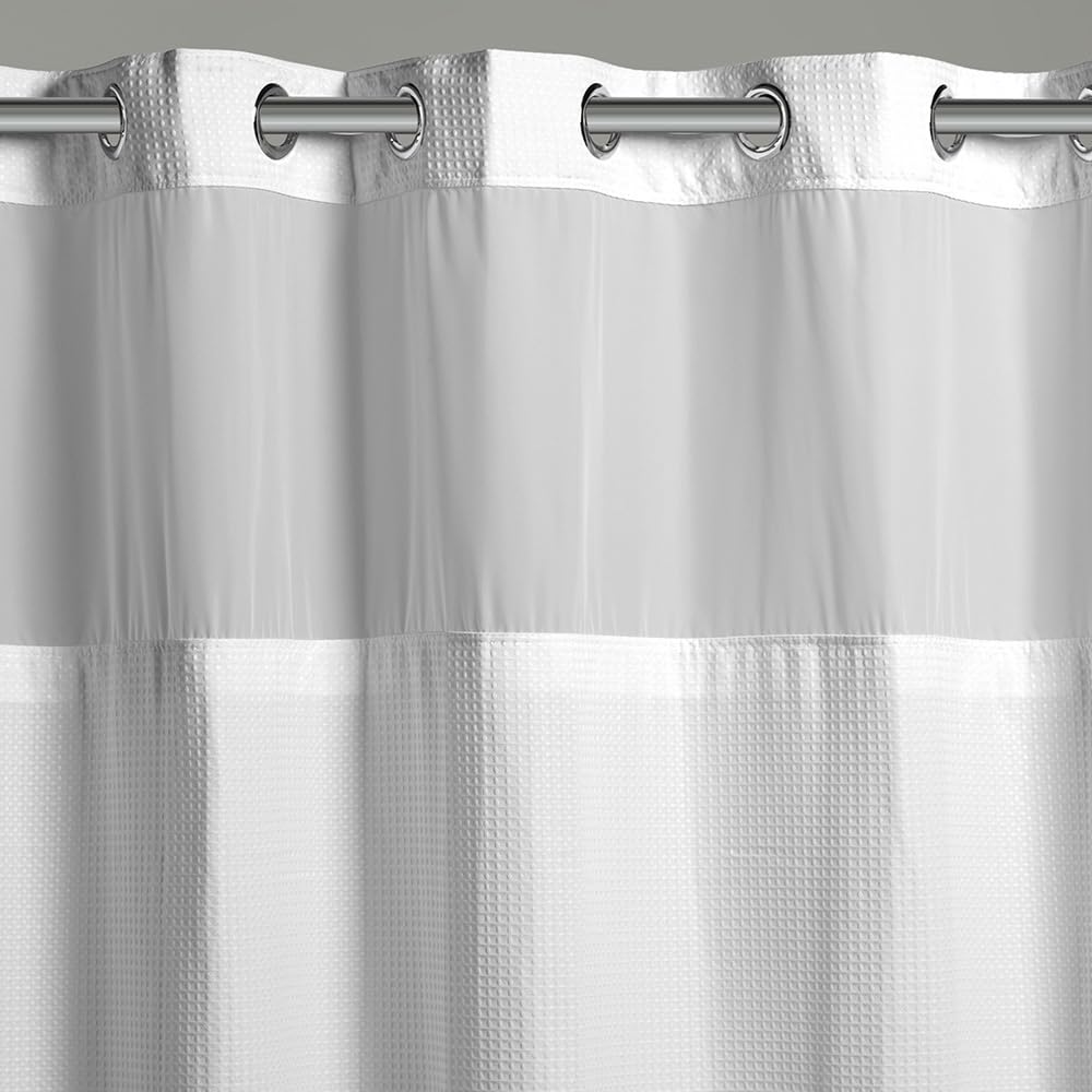 Hookless waffle fabric shower curtain lets light through while keeping water inside.