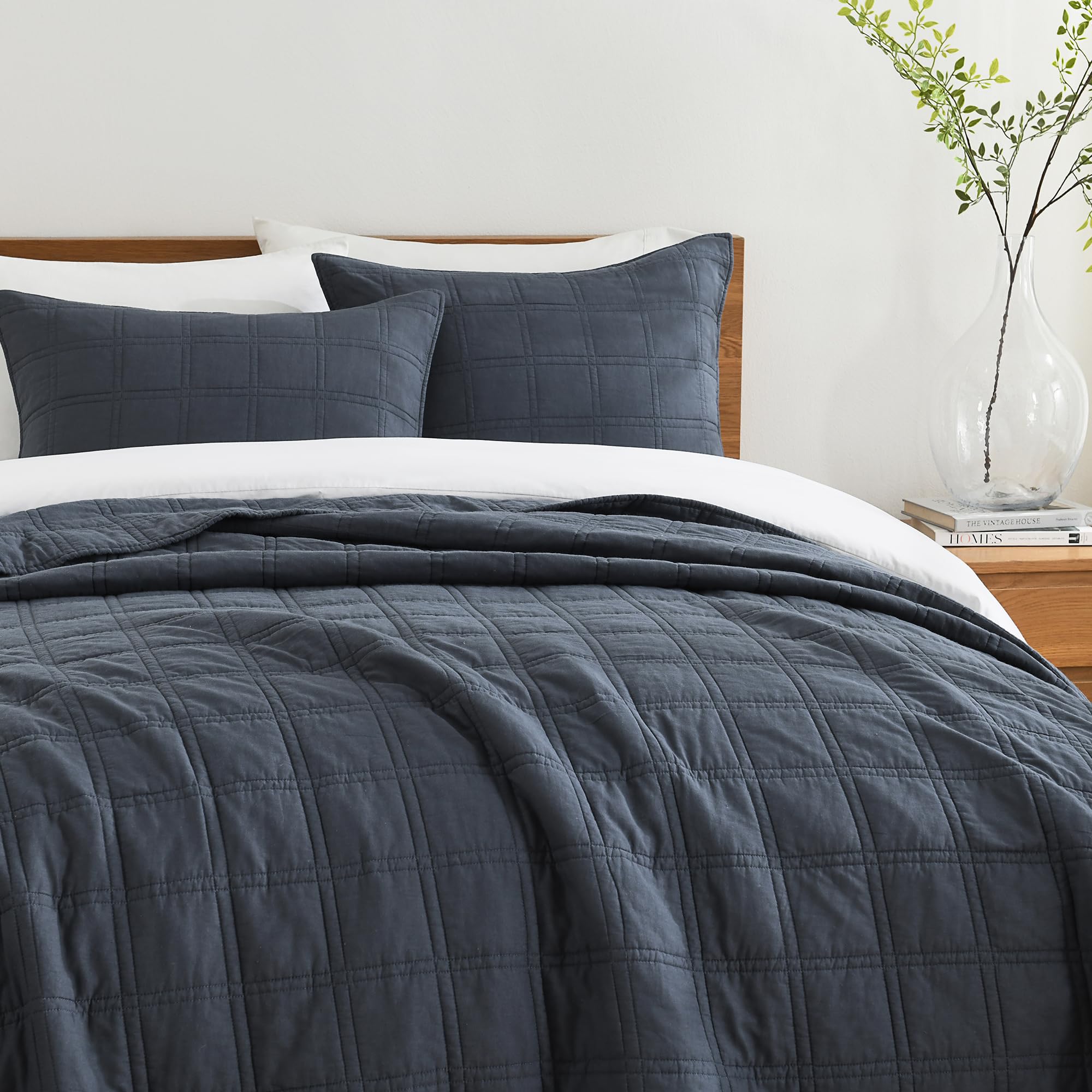 HORIMOTE HOME denim blue quilt two shams complete the coordinated look.