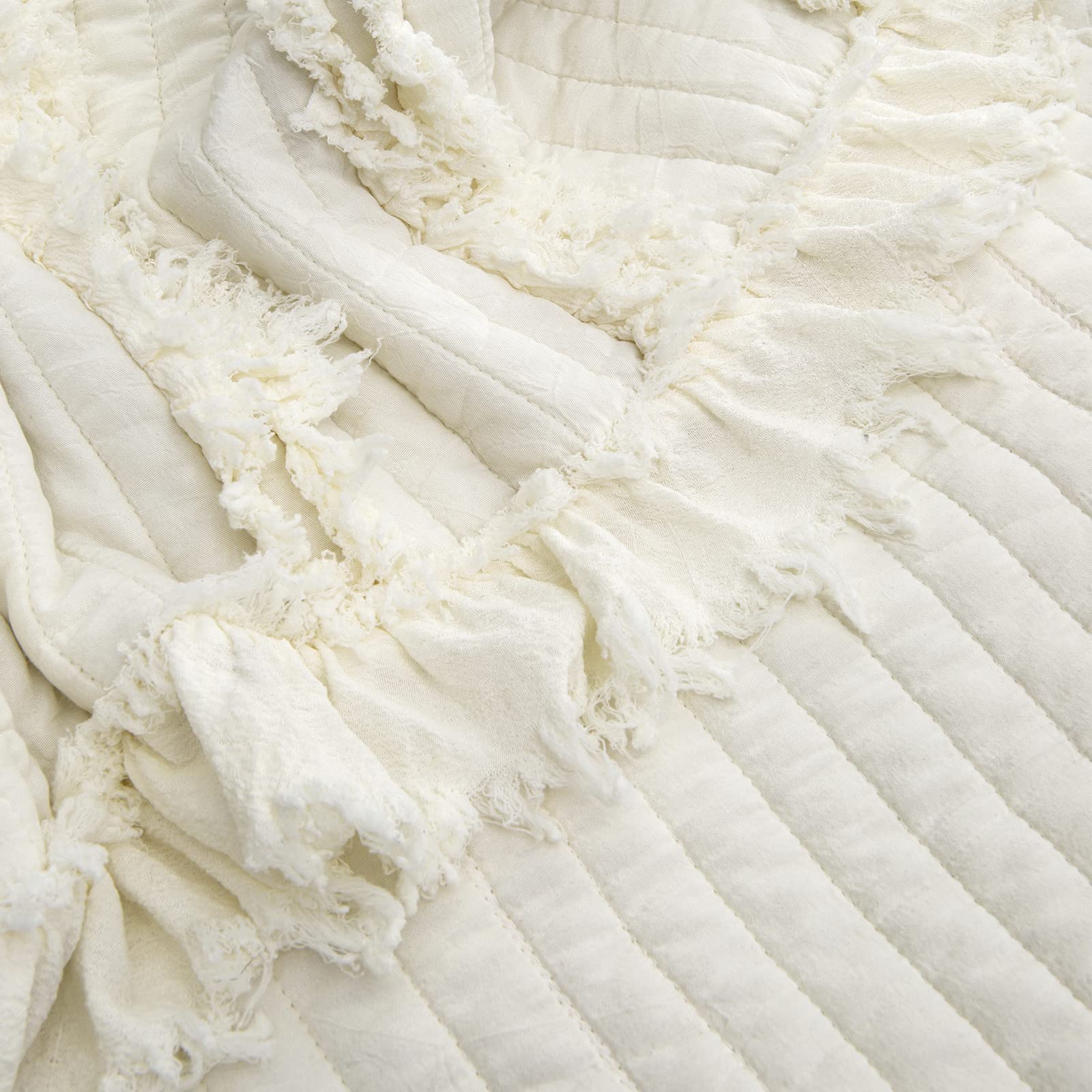 HORIMOTE HOME Quilted throw with ruffle edge adds vintage charm to any room.