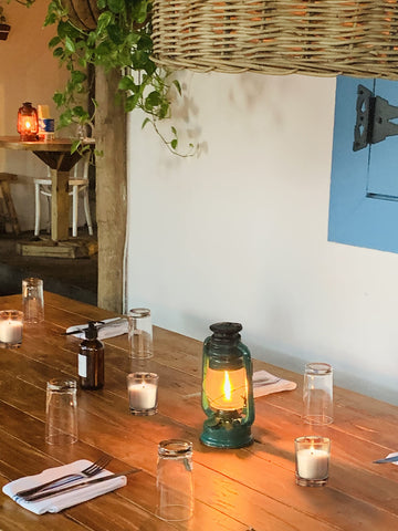 Hosley smokeless burn votive candle creates cozy ambiance for dining and celebrations.