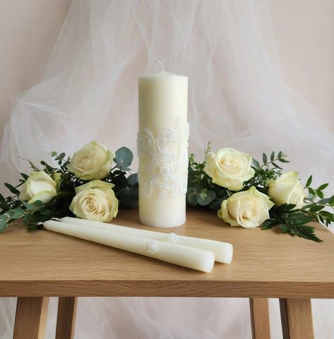 Hosley unity candle set on table creates a refined ceremony focal point.