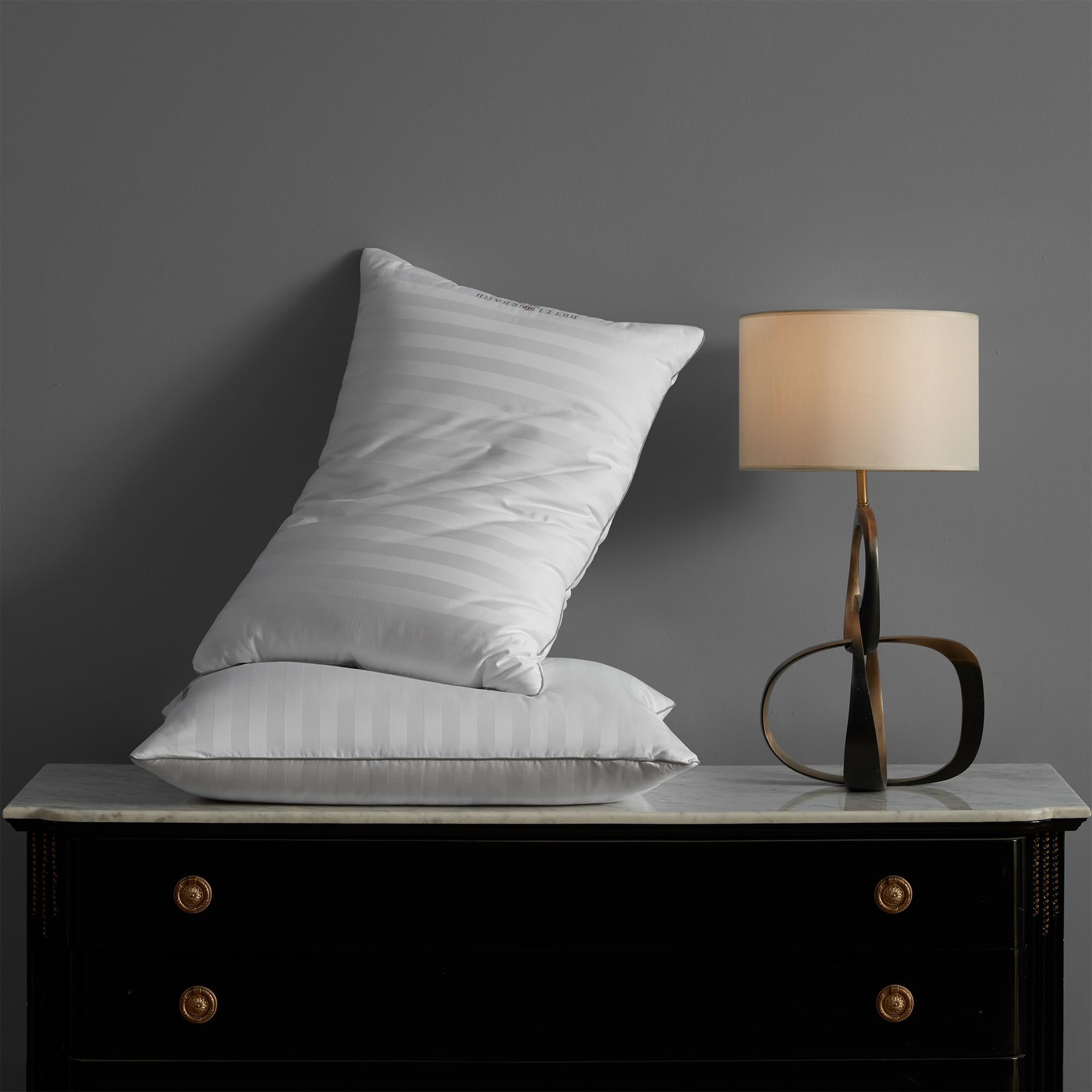 Hotel Grand pillow being patted to restore loft after unboxing.
