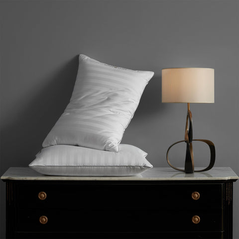 Hotel Grand pillow being patted to restore loft after unboxing.