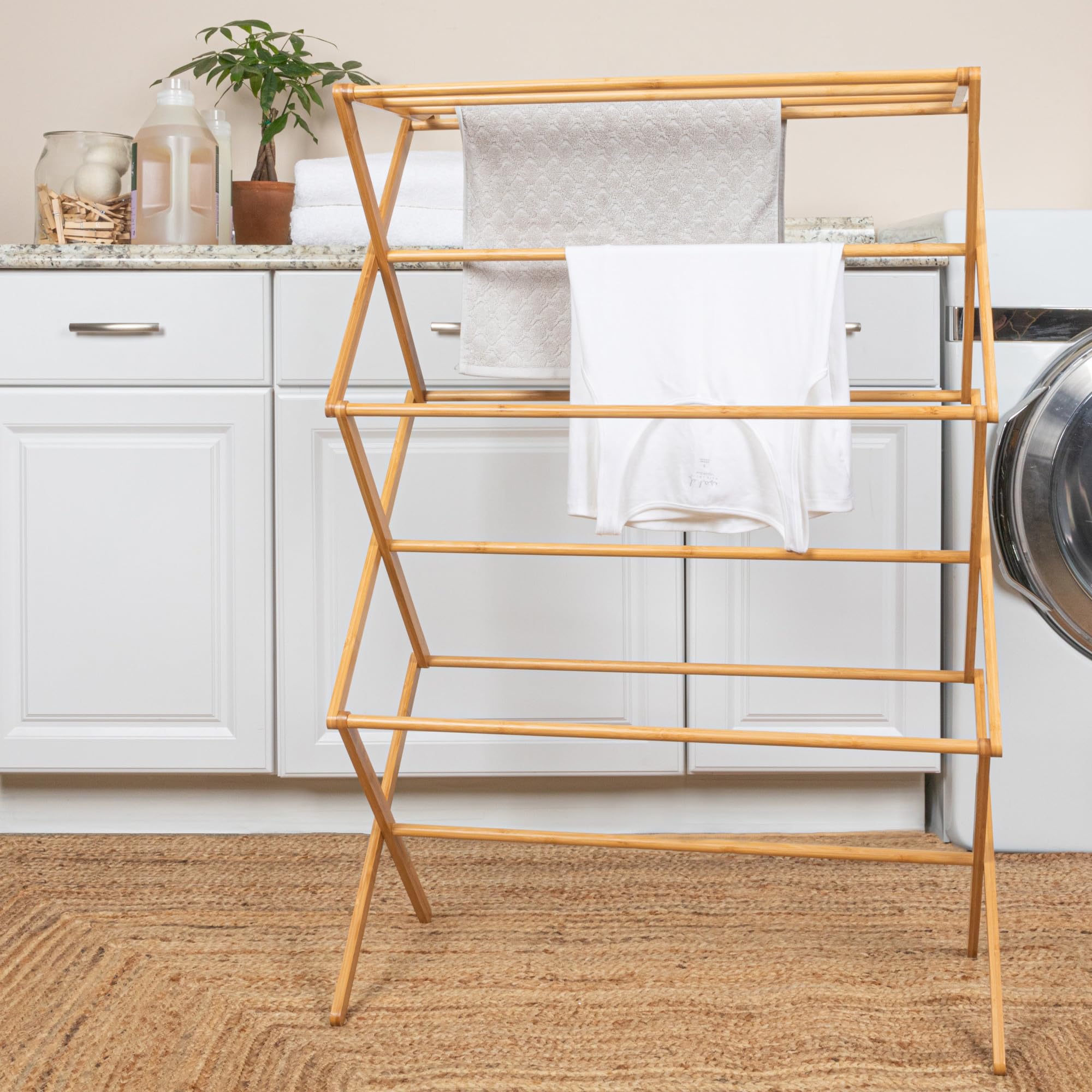 Elegant bamboo shelf rack offers eco-friendly materials and stylish laundry space.