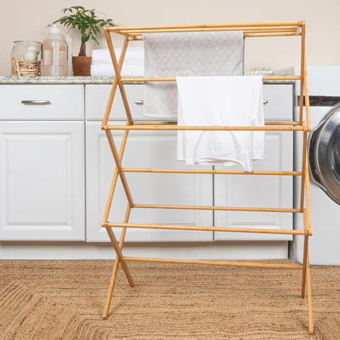 Elegant bamboo shelf rack offers eco-friendly materials and stylish laundry space.