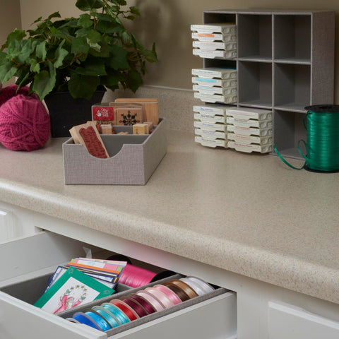 Household Essentials organizer displayed on a dresser for neat surface storage.