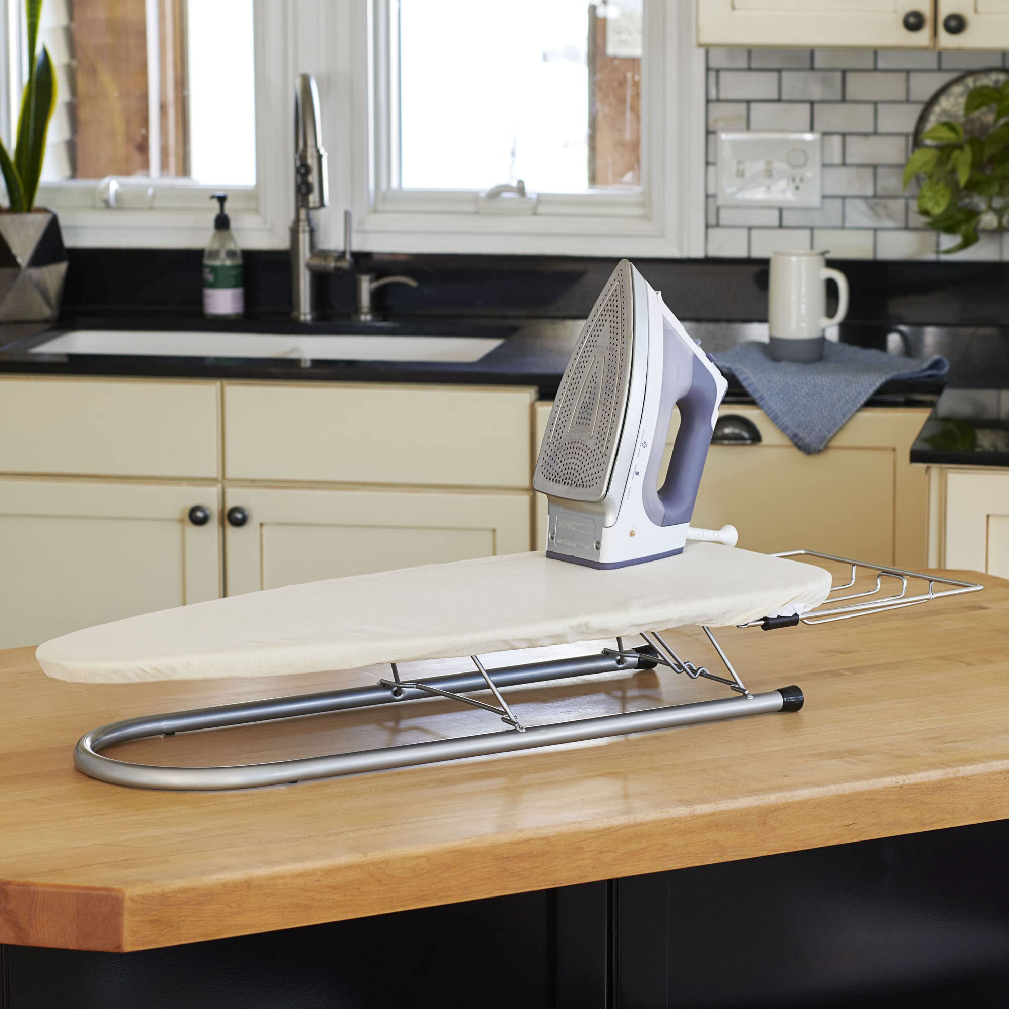 Household Essentials compact board, collapsed, ideal for door storage in dorms.
