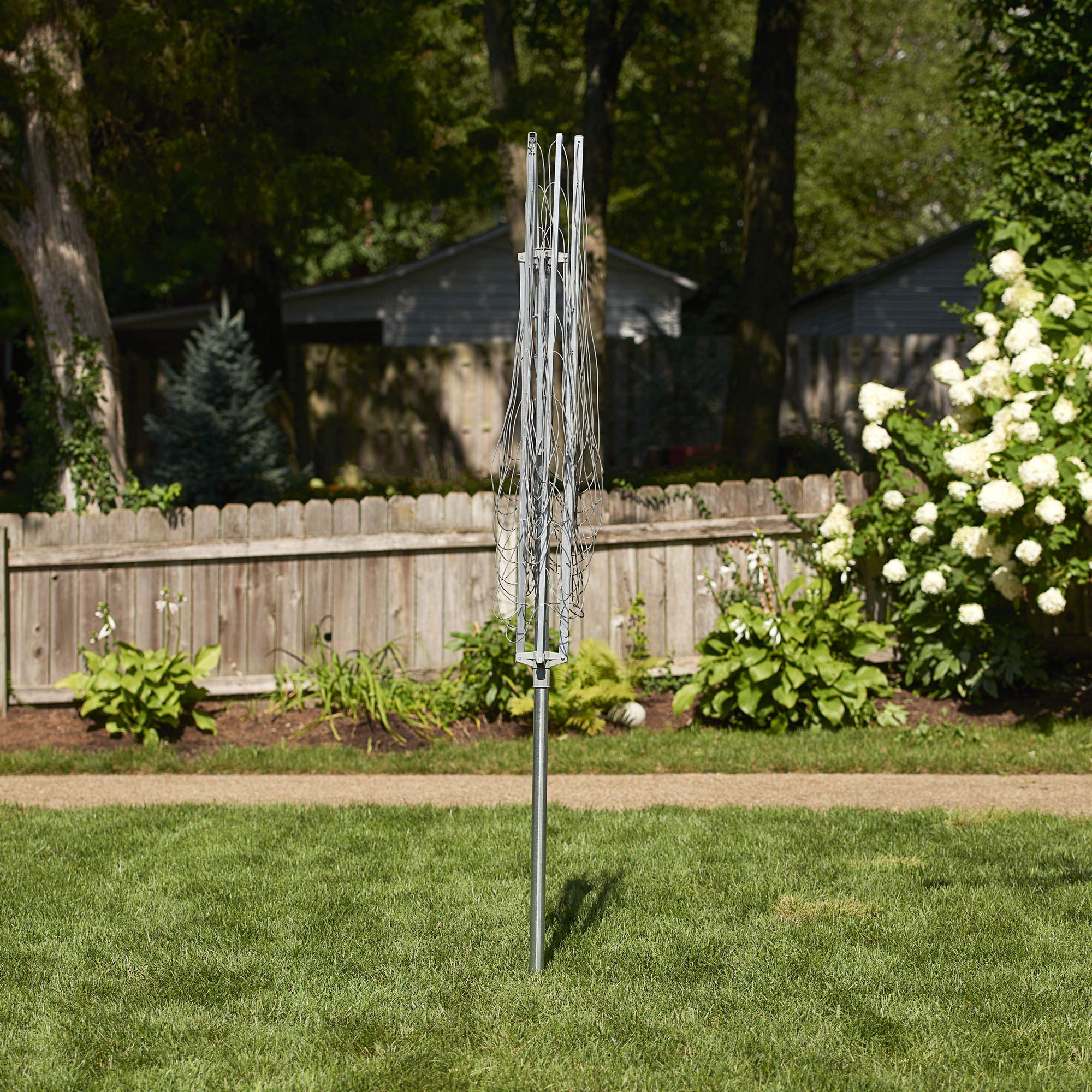 Household Essentials rotary unit stands 72 inches tall for versatile outdoor laundry setup.