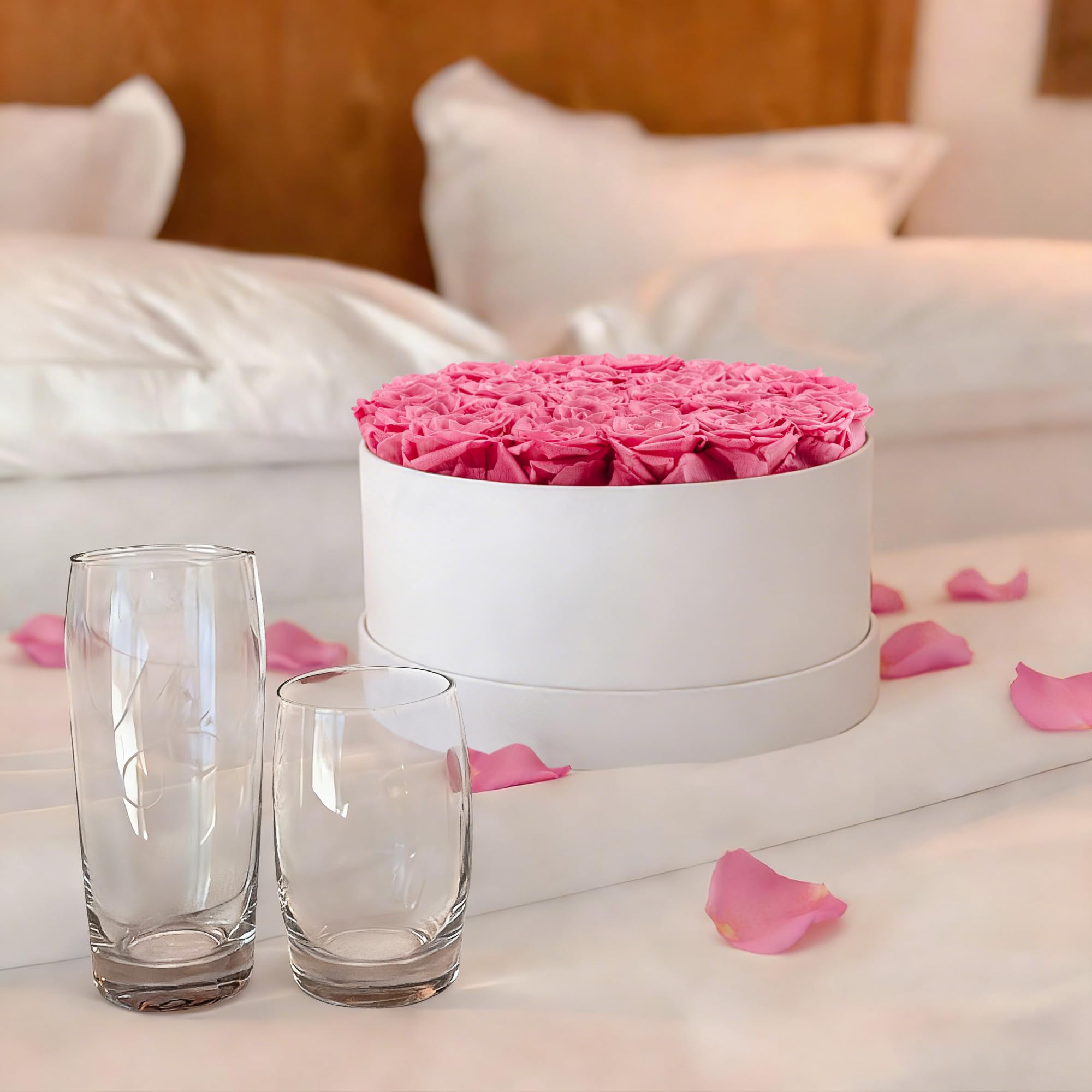 Luxury white round bucket with preserved roses for elegant display.