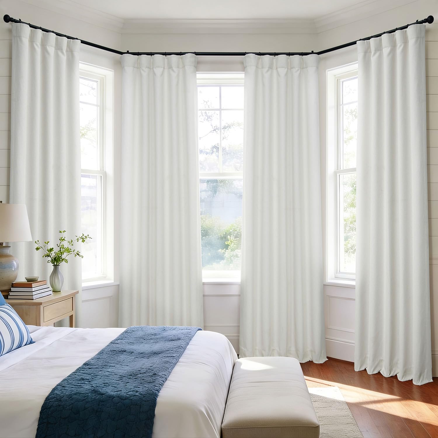 Neutral beige linen curtains create a serene bedroom ambiance