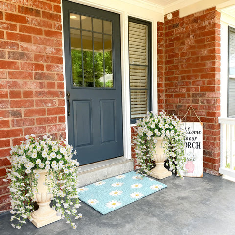Hrobek hanging petunias in pot setup—simple vertical decorating for spaces.