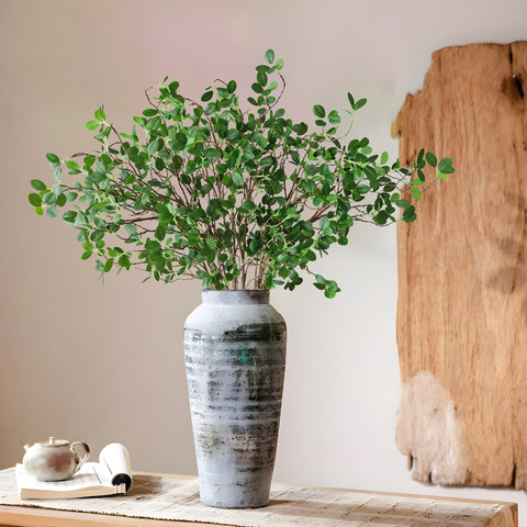 Htmeing artificial eucalyptus with real-touch leaves enhances arrangements.