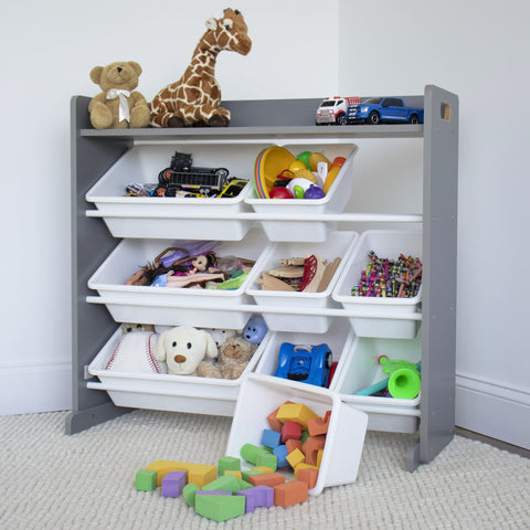 Humble Crew white bins for tidy toy and book storage in a toddler space.
