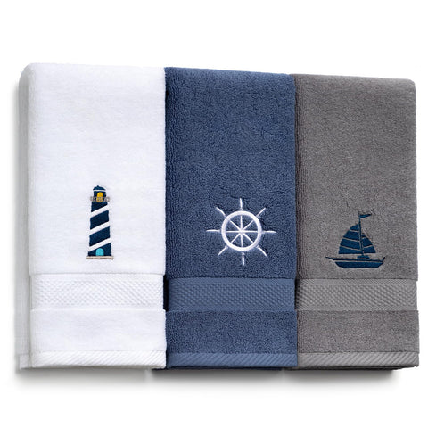 HunnmingRe nautical hand towel with lighthouse embroidery adds coastal charm to the bathroom.