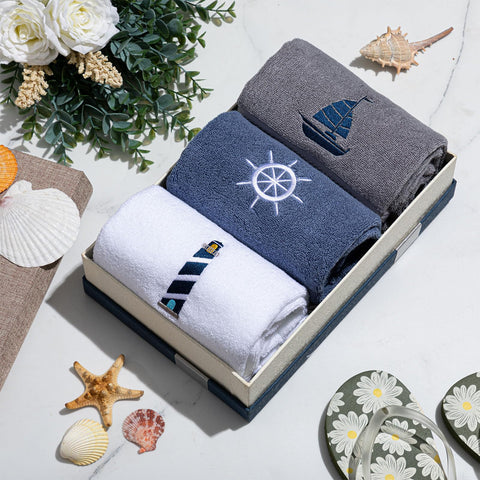 HunnmingRe sailboat-embroidered towel enhances bath area with nautical flair.
