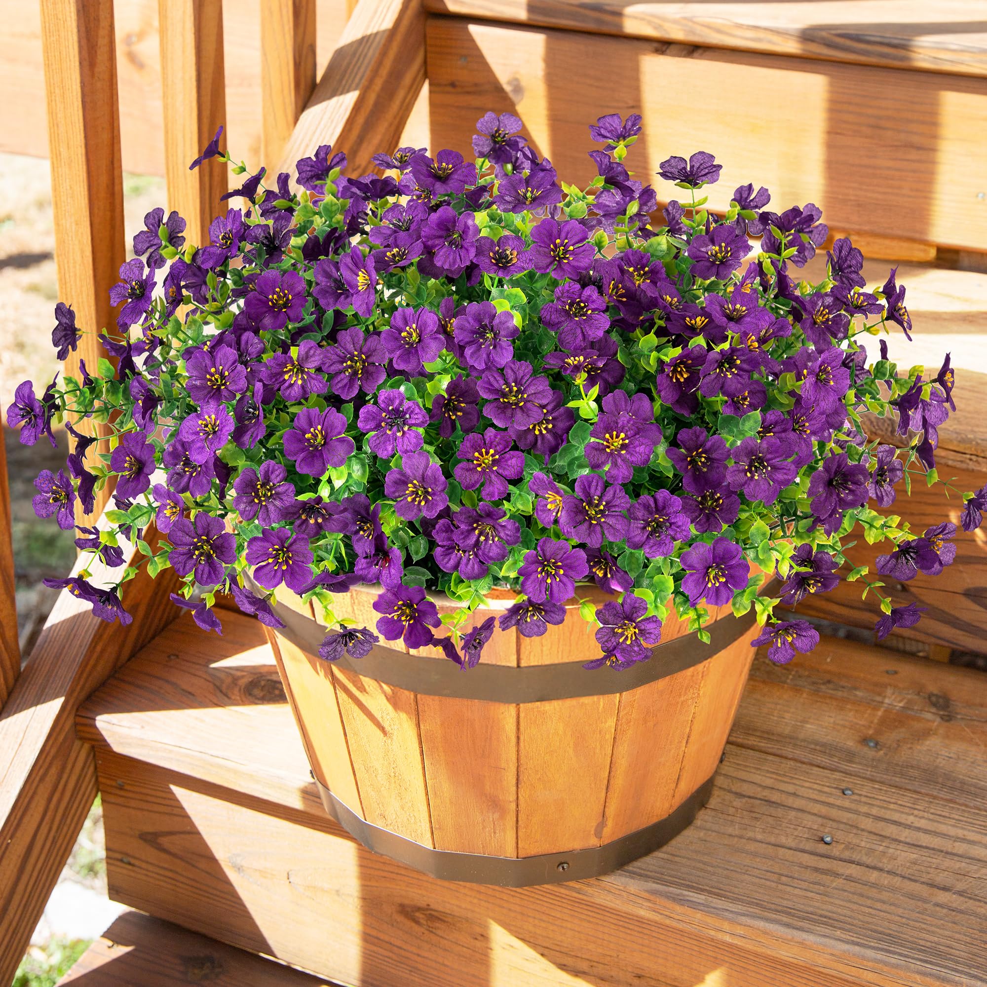 HyeFlora purple daisy bundles arranged in an indoor garden display
