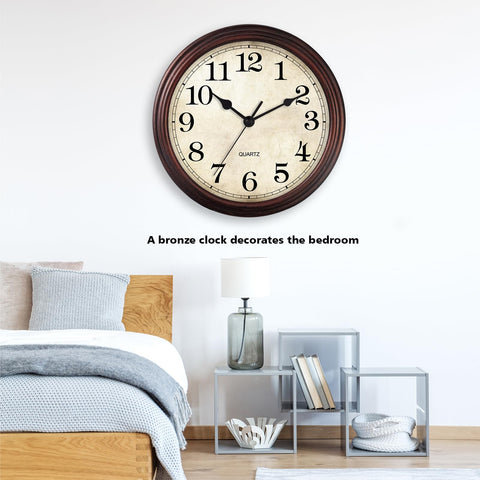 HYLANDA bronze wall clock displayed in a living room setting.