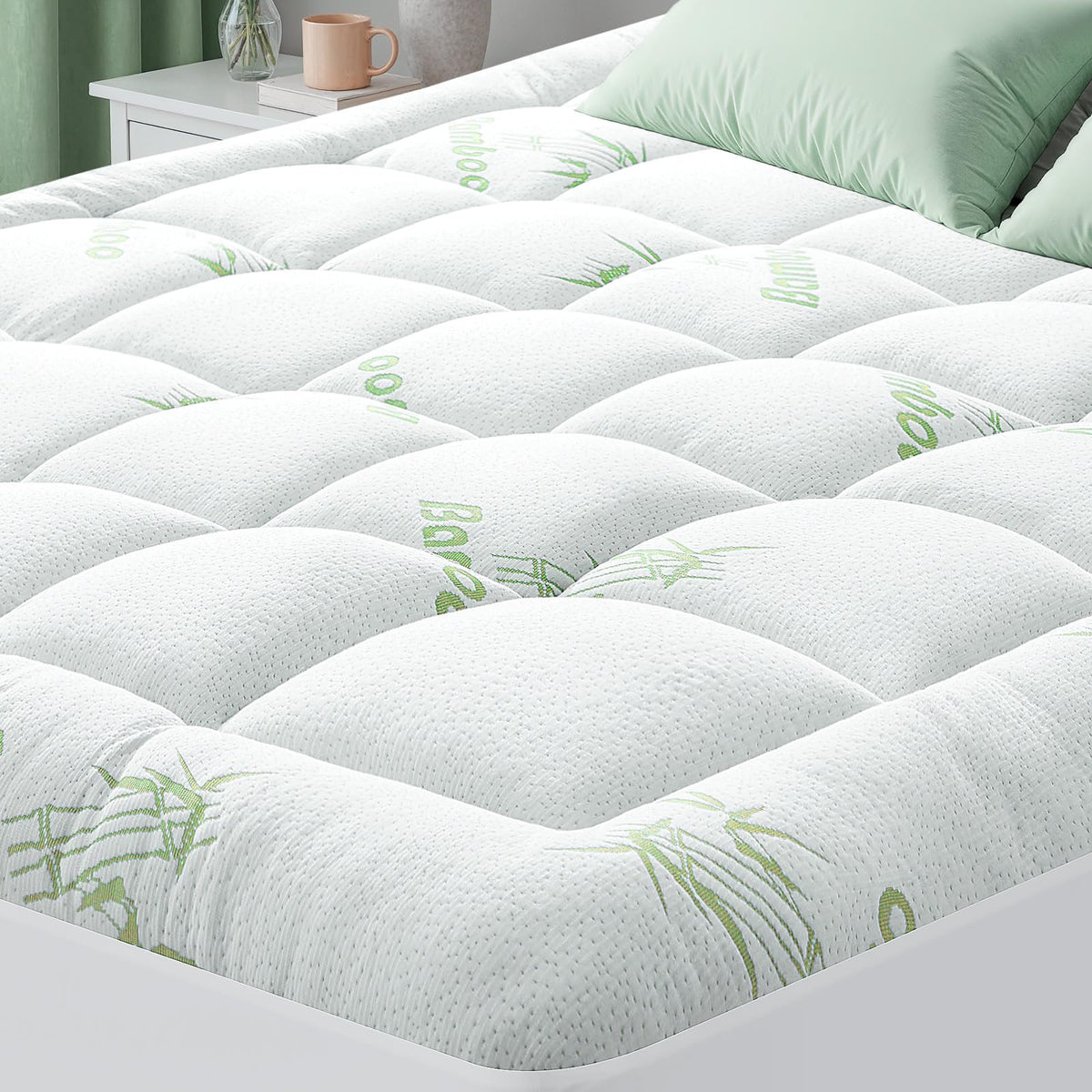HYLEORY bamboo cooling mattress topper laid on bed for cool comfort
