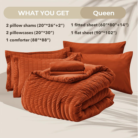 HYMOKEGE Burnt Orange Queen Comforter on bed demonstrating all-season warmth and loft