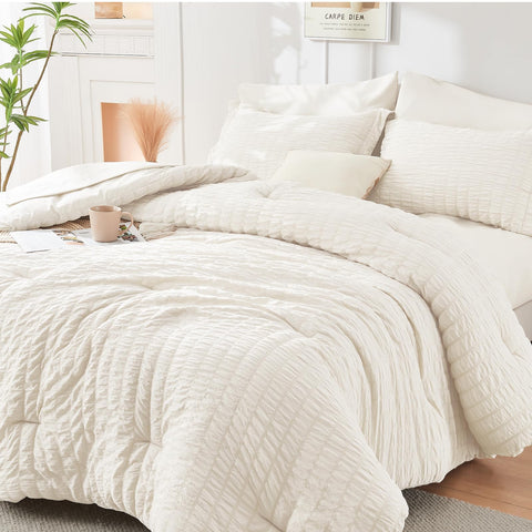 HYMOKEGE Ivory full-size comforter set in seersucker provides all-season warmth.